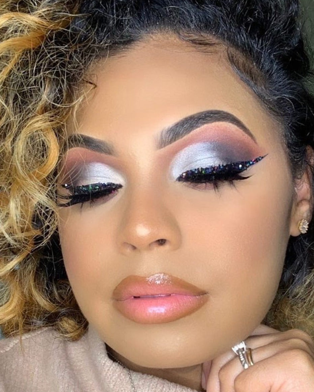 Influencer wearing creative makeup using The All I Need Collection.