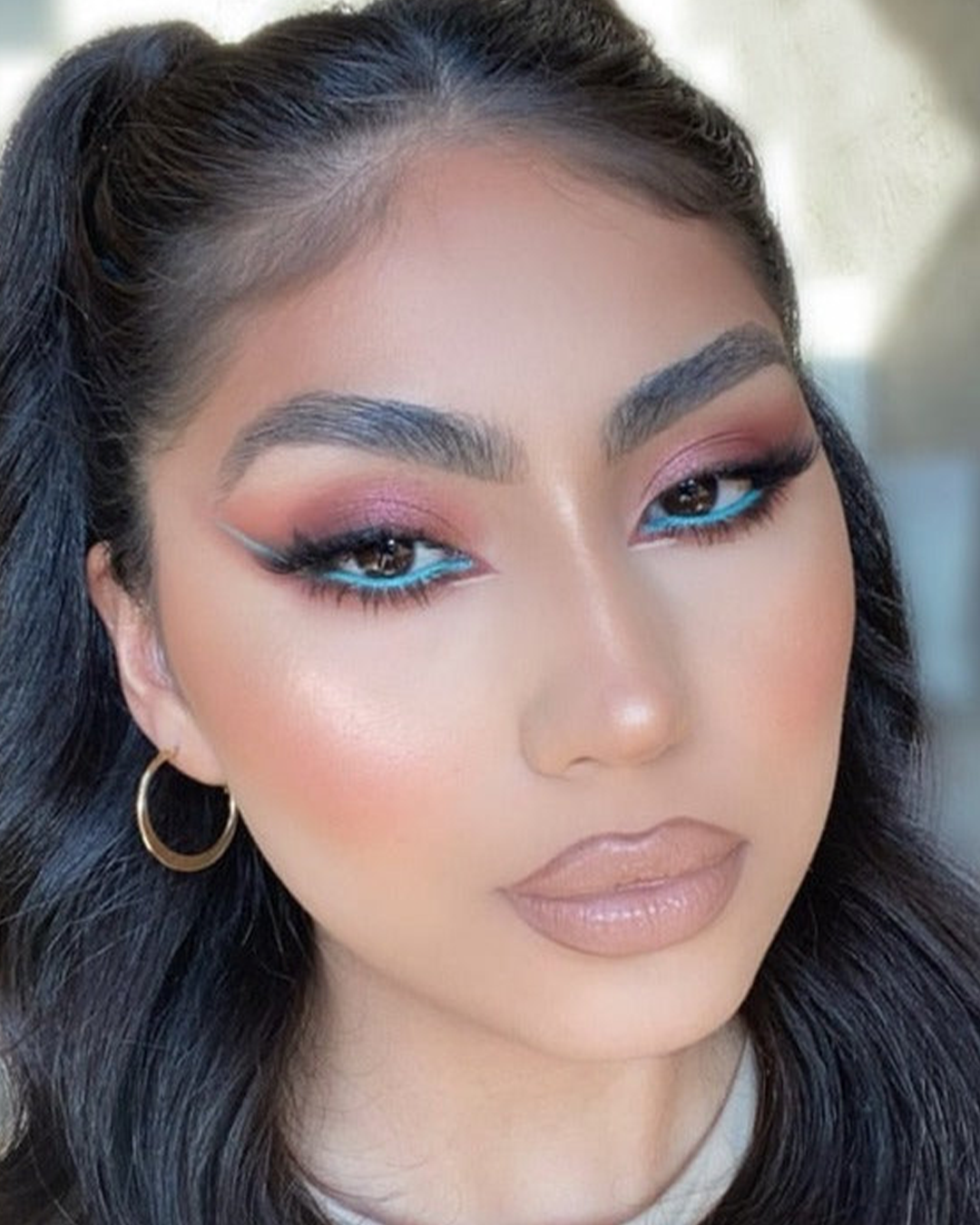 Influencer with creative makeup using The All I Need Eyeshadow Palette.