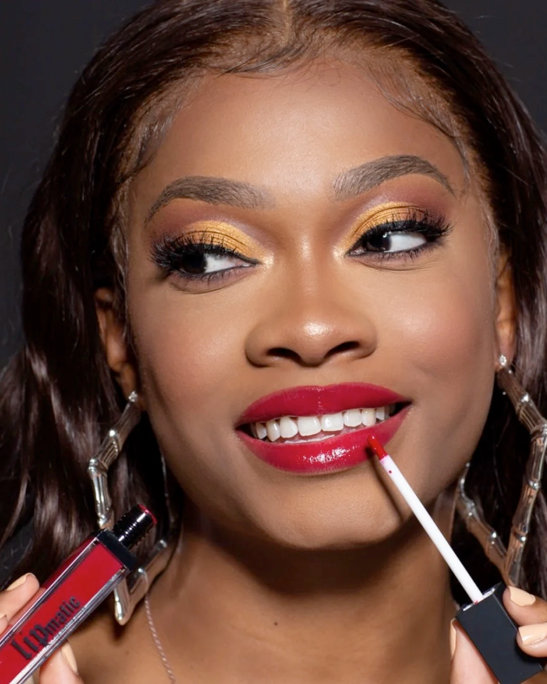 Model wearing 110th Street LipShine and eyeshadow from the All I Need Eyeshadow Palette.