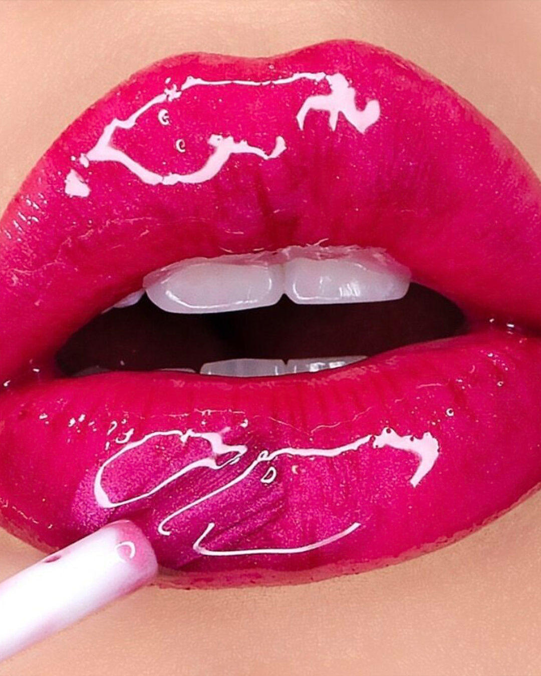 Ex-Factor LipShine on a model's lips.