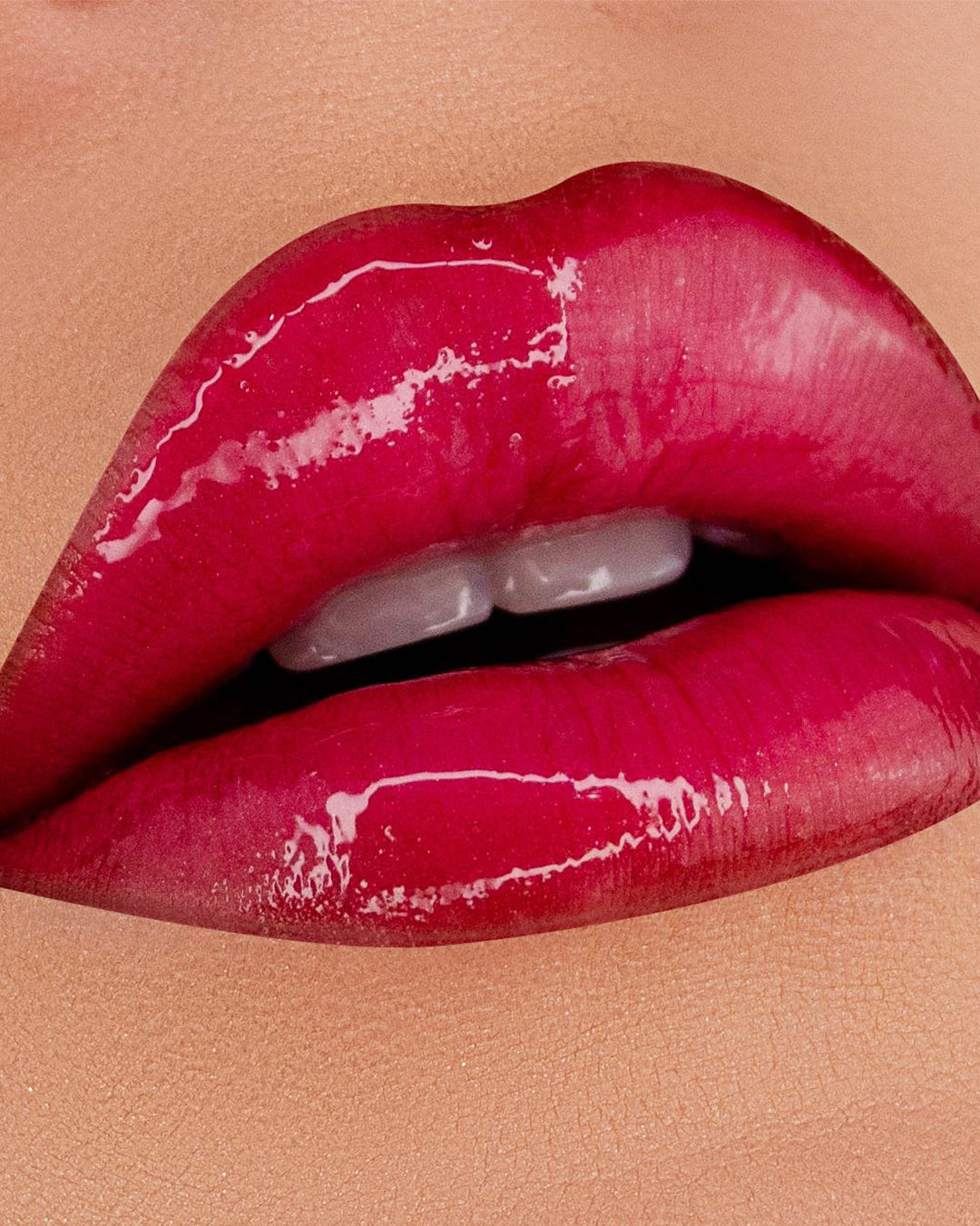 A close up of lips wearing Flushing Fuchsia LipShine.