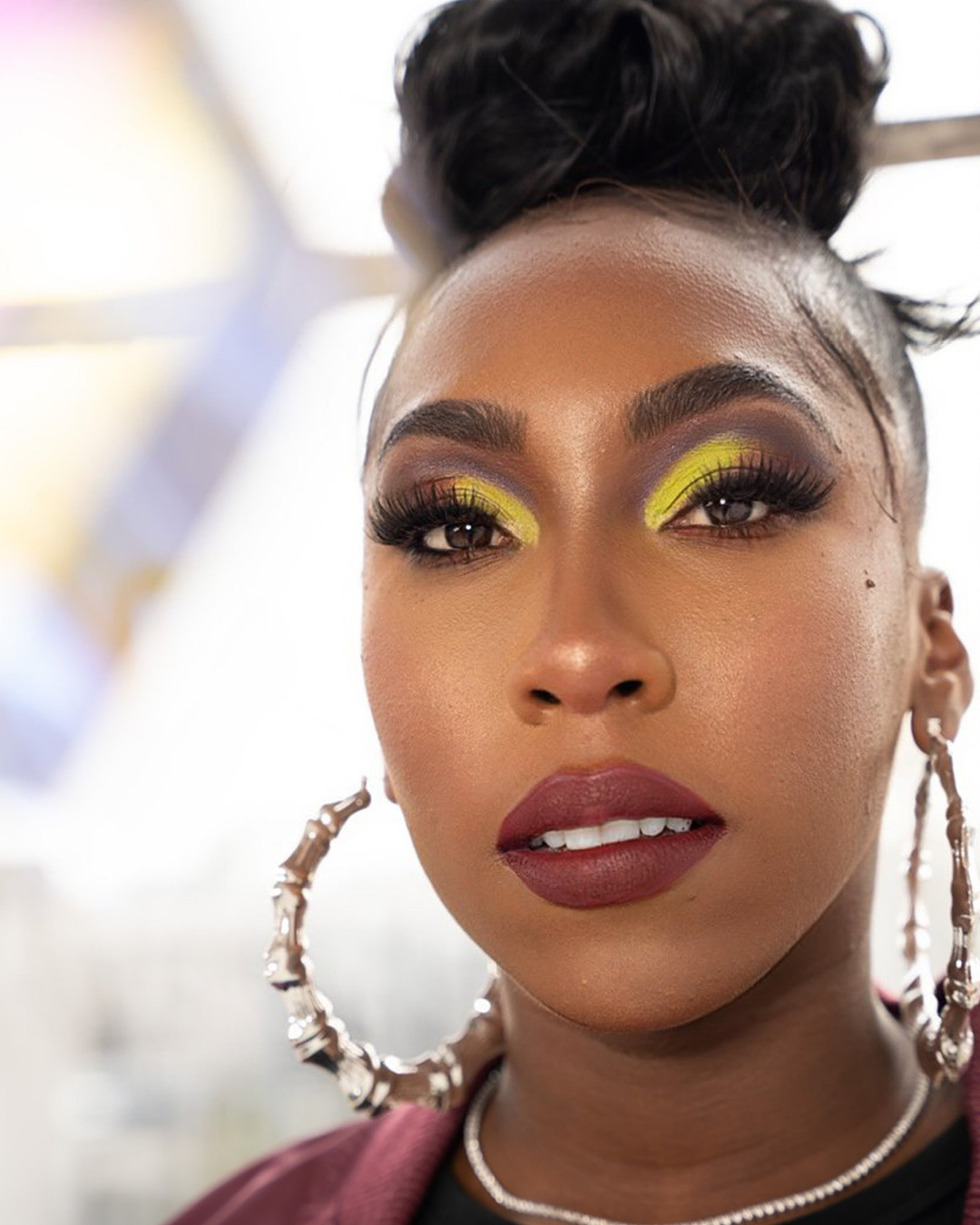 Model with creative makeup wearing the Graffiti Collection.
